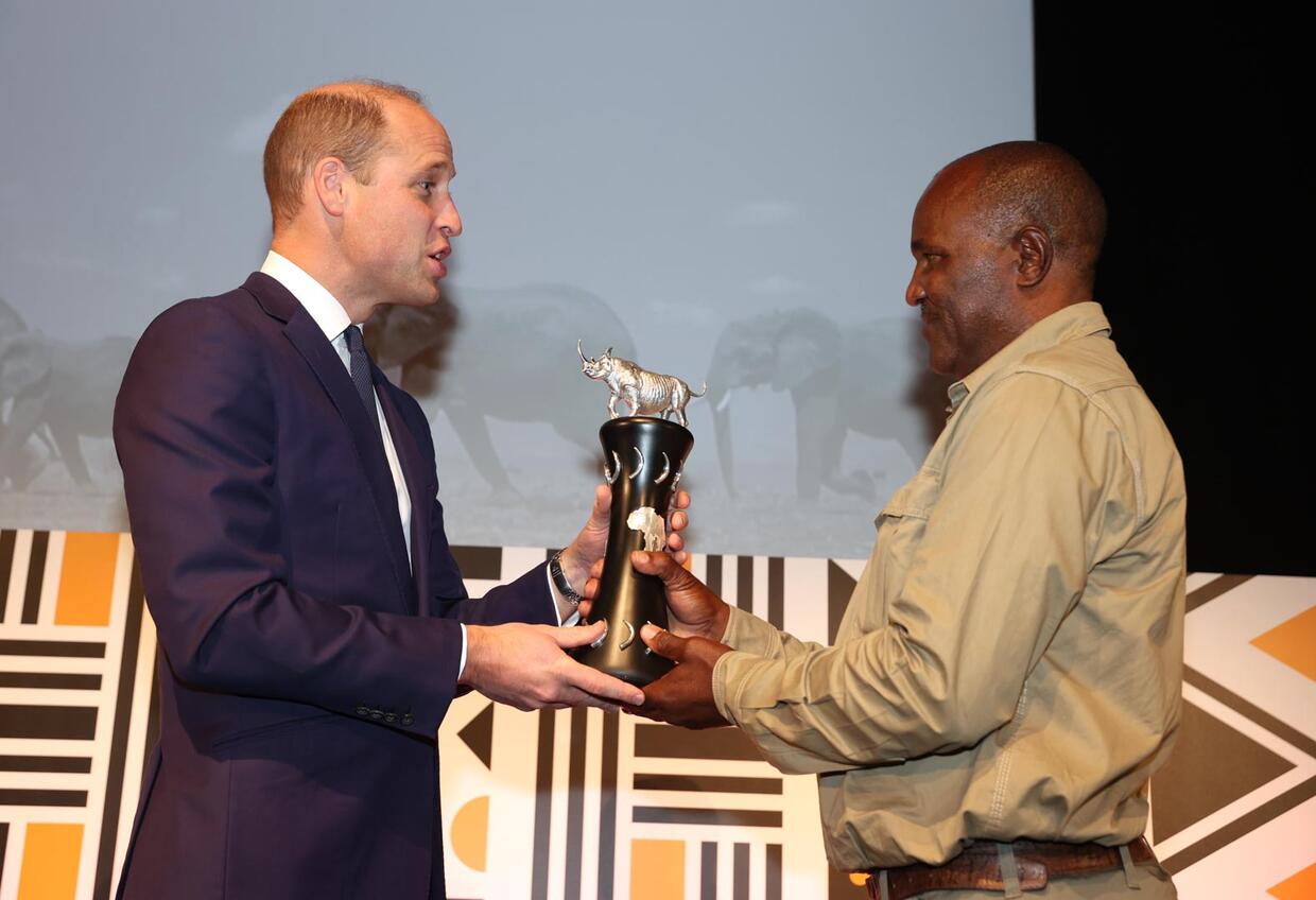 (L-R) Prince William, Duke of Cambridge presents Simson Uri-Khob with his award during the Tusk Conservation Awards 2021 